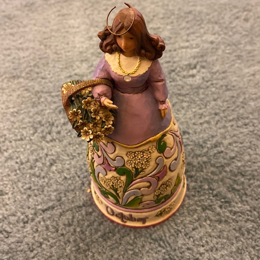 Small October angel. Purple top and flowered dress.
